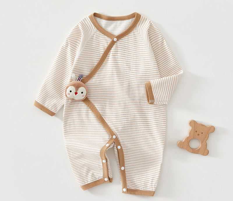 Striped baby romper with brown accents and a matching toy on a white background