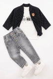 Children's outfit with black cardigan, white t-shirt with text, gray jeans, and white shoes on a white background